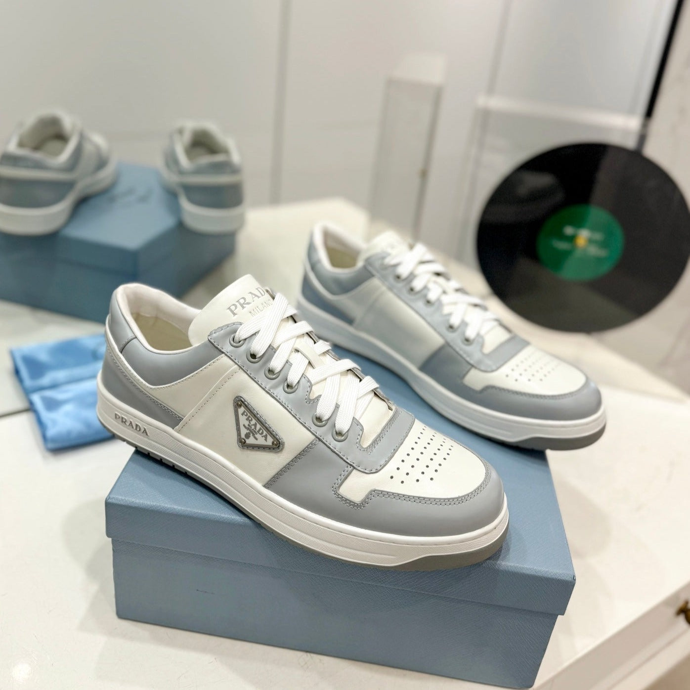 Luxury PradaDOWNTOWN PERFORATED SNEAKERS WHITE AND GRAY CALFSKIN
