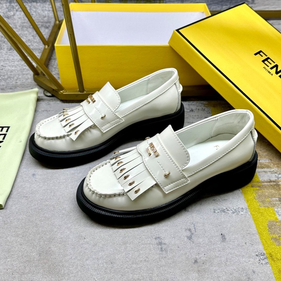 Luxury FendiLuxury FendiBAGUETTE LOAFERS IN WHITE CALFSKIN WITH GOLD HARDWARE
