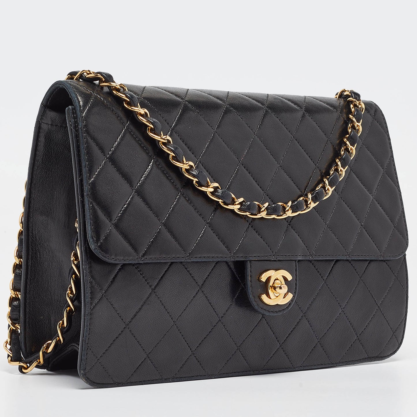 CHANEL Black Quilted Leather CC Flap Bag