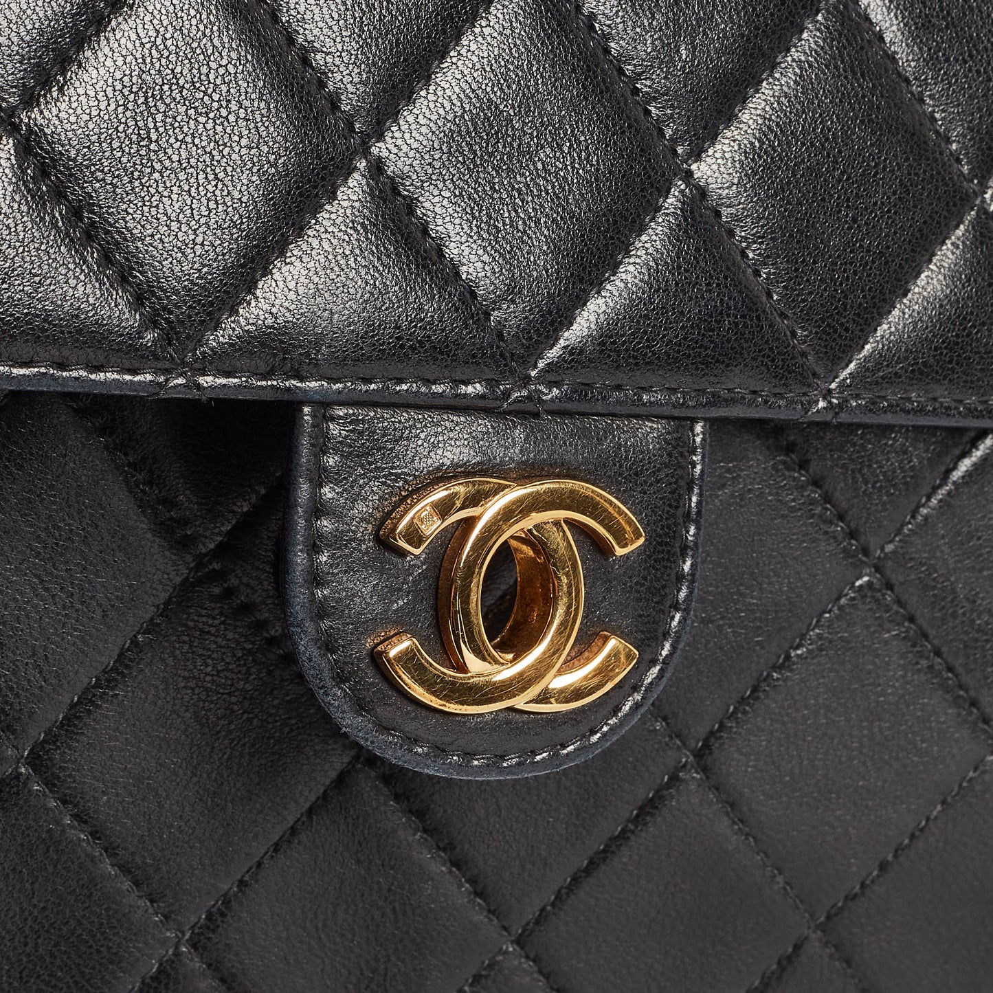 CHANEL Black Quilted Leather CC Flap Bag