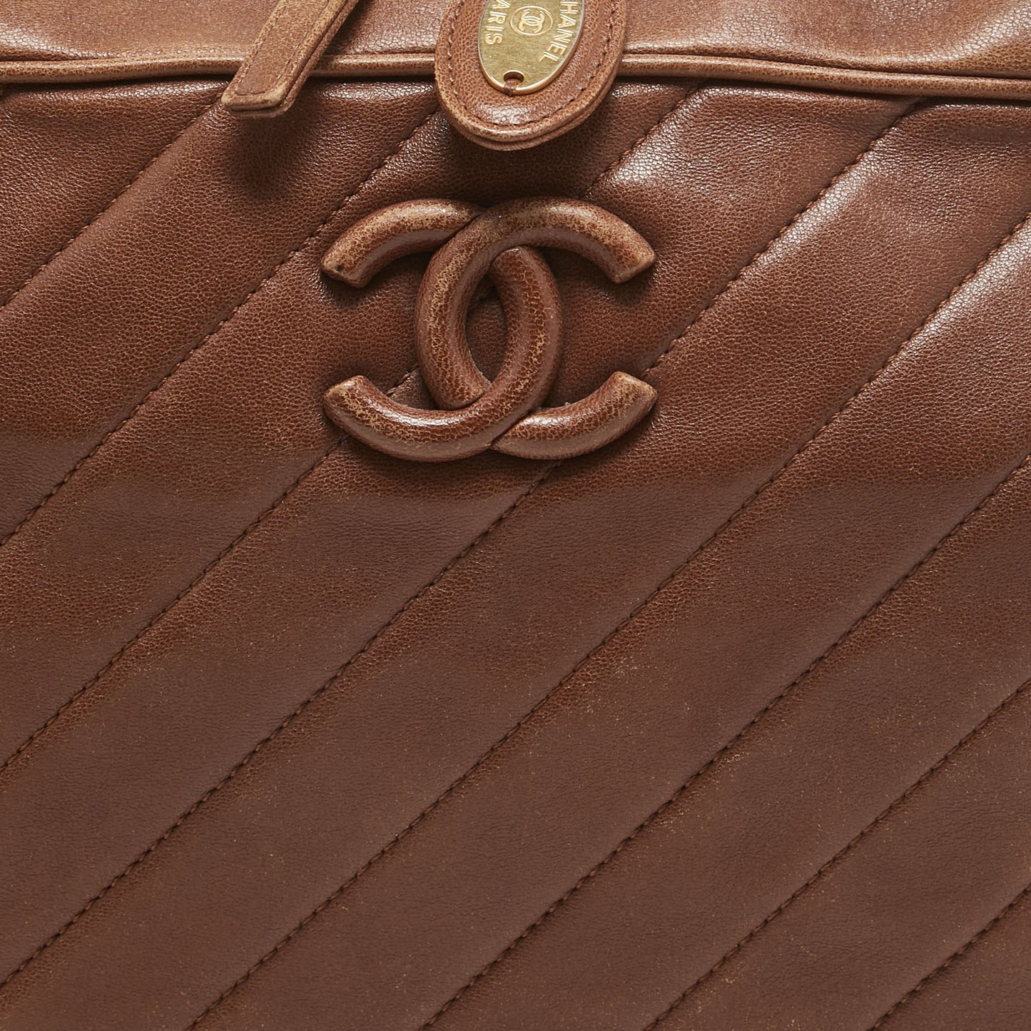 CHANEL Brown Diagonal Quilted Leather CC Covered Signature Flap Bag