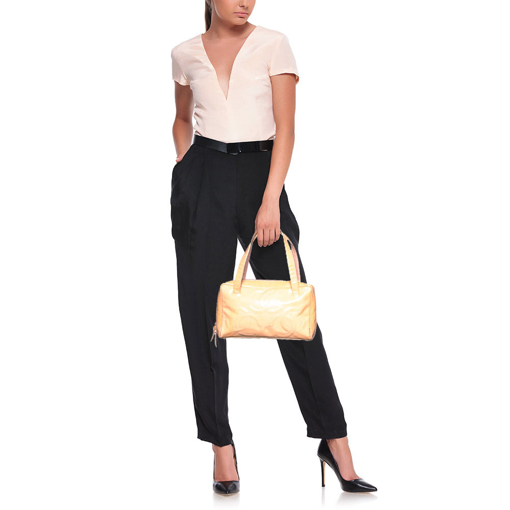 Luxury Chanel Peach Patent Leather Triple CC Bag