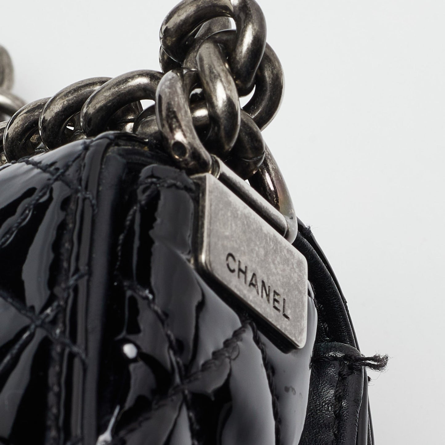 CHANEL Black Patent Leather New Medium Reverso Boy Flap Bag
